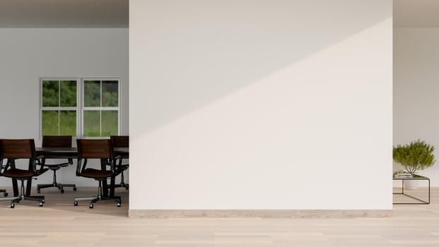 A minimalist office corridor features a parquet floor, a white empty wall, and a meeting room. photo