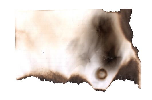 Burnt page on a white background. Vintage burned paper edges heart background photo