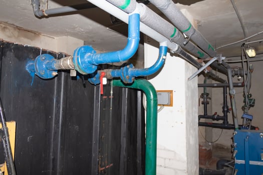 A room for dosing chemicals of chlorine and acid when feeding into the pool. Water circulation system in the pumping room. photo