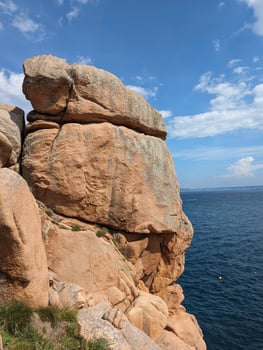Clear Sky over Pink Granite Cliffs and Sea in Brittany, France photo
