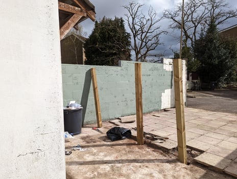 Patio in the process of a fence installation photo