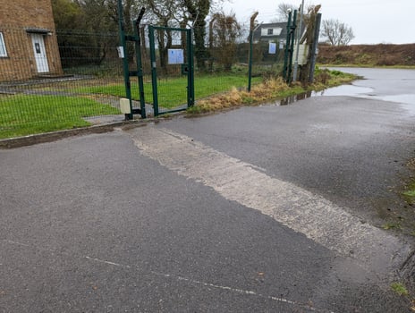 Puddle on a country road after rain photo