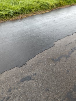 Deteriorating Asphalt and Concrete Road Surface in Wales photo