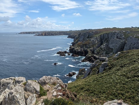 Pointe Du Van Coastal Hike Cliffs, Rocks, and Clear Sky photo