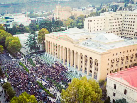 25th may, 2023 - Tbilisi, Republic of Georgia - Post election protests in Tbilisi. Aerial view of crowds of people in front of parliament building in capital city Tbilisi photo