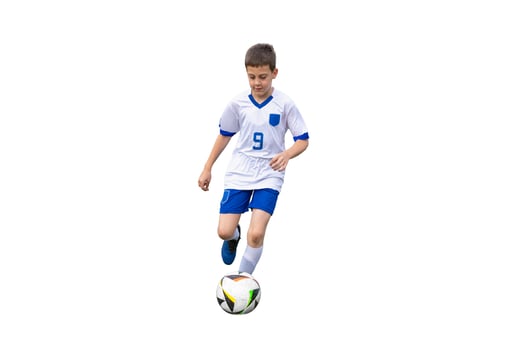 Isolated young soccer player in a white dress dribbling the ball photo