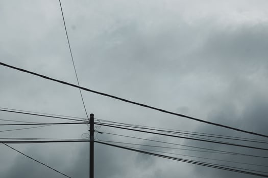 Electricity poles and high voltage power lines photo