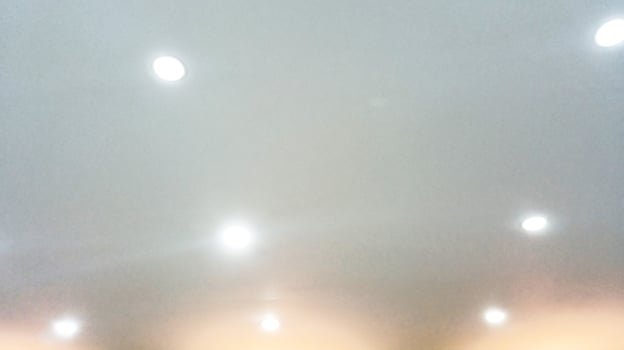 blur of ceiling lamp light in room interior photo