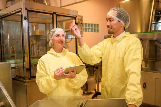 Professional winemaker controlling wine making process and quality at winery factory photo
