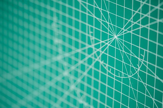 Green cutting mat with geometric patterns photo