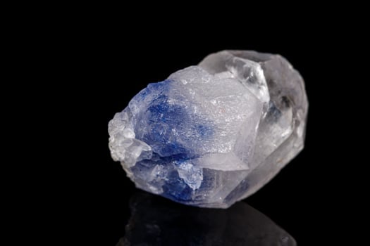 Macro tourmaline mineral stone on black photo