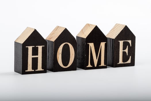 Wooden cubes with the inscription home on a white background photo