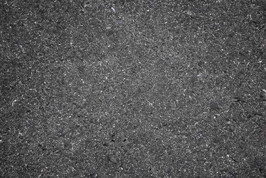 A smooth dark grey asphalt pavement texture with small rocks,Asphalt Dark Texture for Roads,Soil texture background photo