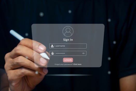Hand holding a pen to login username and password on virtual screen. User sign registration page concept. photo