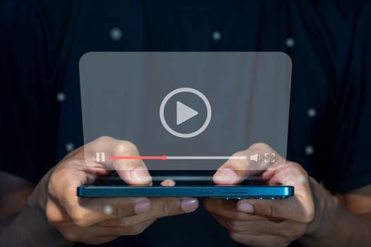 A man watching a or movie via a smart phone. streaming on internet concept. photo