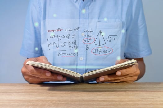 Man holding a notebook for studying mathematics photo