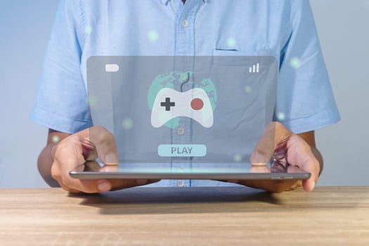 Man playing online games on a tablet or gadget photo
