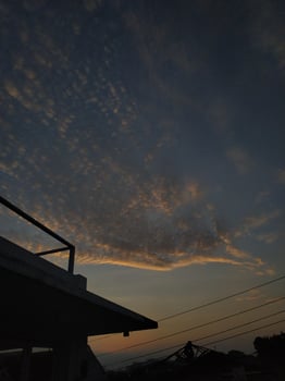 dramatic morning sky or Sunset sky for background seen from above the house photo