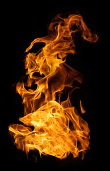 Fire and burning flame of explosive fireball isolated on dark background for abstract graphic design concept photo