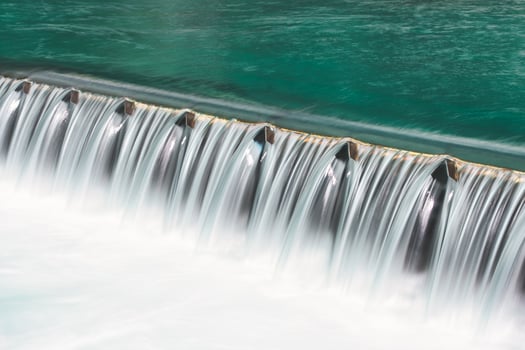 Foamy water in river dam photo