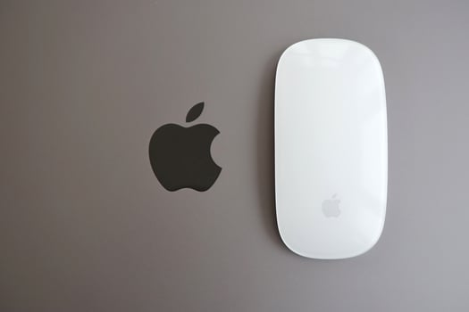KYIV, UKRAINE - NOVEMBER 27, 2023 Apple Magic Mouse 3rd generation lies with grey MacBook 2021 photo