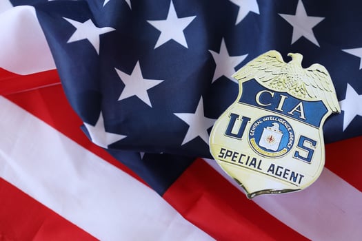 KYIV, UKRAINE - MARCH 9, 2024 US CIA Central Intelligence Agency badge on United States of America flag photo