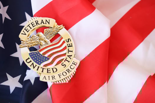 KYIV, UKRAINE - MARCH 9, 2024 US Air Force Veteran badge on United States of America flag photo