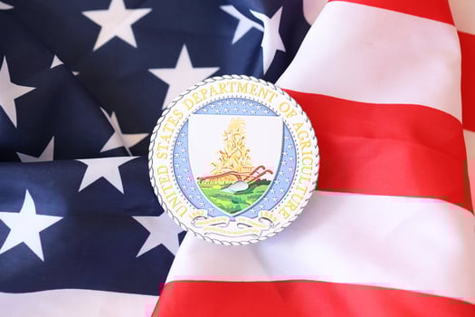 KYIV, UKRAINE - MARCH 9, 2024 US Department of Agriculture seal on United States of America flag photo