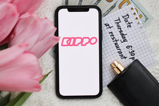 KYIV, UKRAINE - FEBRUARY 23, 2024 Kippo logo of famous dating website or app on iPhone display photo