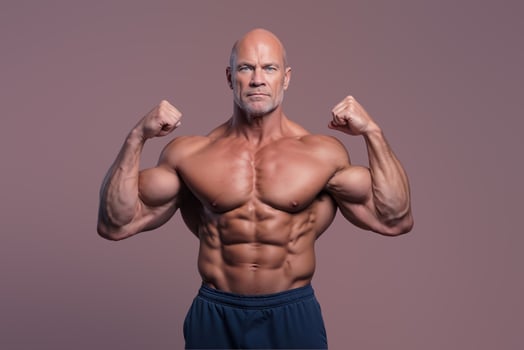Fit bald man poses showing off his ripped muscles and strength on a neutral background photo