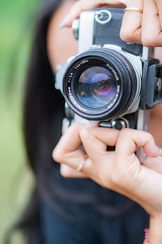 Person Holding a Vintage Camera photo