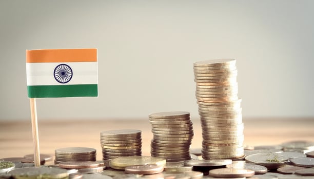 Stacked coins symbolizing financial growth, with India Flag photo