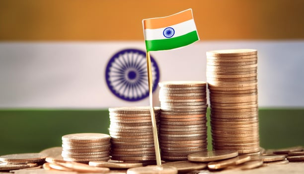 Stacked coins symbolizing financial growth, with India Flag photo