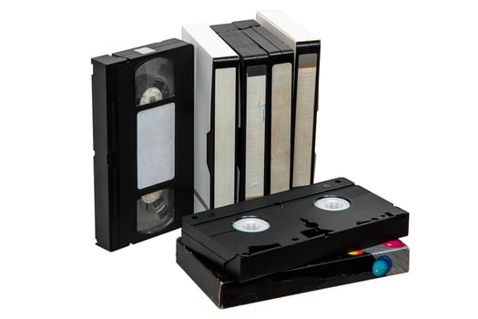 Pile of VHS cassettes. Vintage media. Isolate on a white back. photo