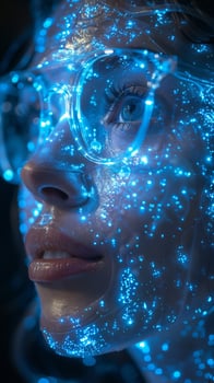 A woman, wearing glasses that emit blue light, is looking at the camera photo