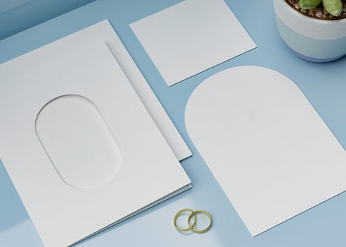 An invitation card with an arch-shaped hole, perfect for wedding invitation mockups photo