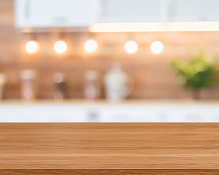 Wood table for food display with blurred kitchen photo