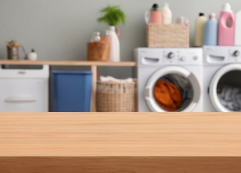 Wood table for display products on blurred laundry room photo