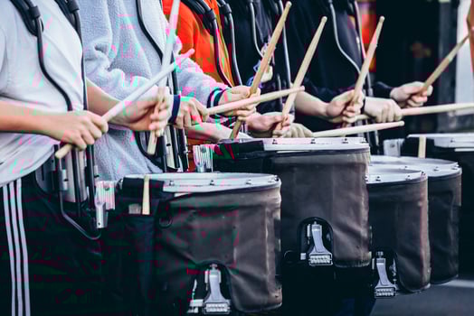 section of a marching band drum line warming up before rehearsal photo