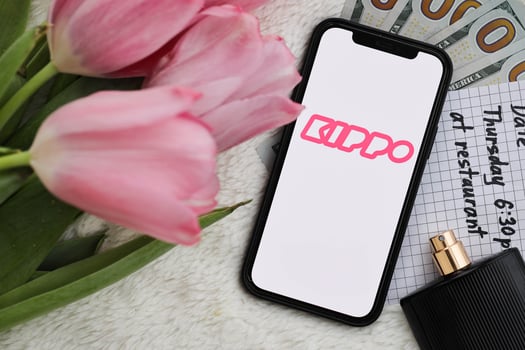 KYIV, UKRAINE - FEBRUARY 23, 2024 Kippo logo of famous dating website or app on iPhone display photo