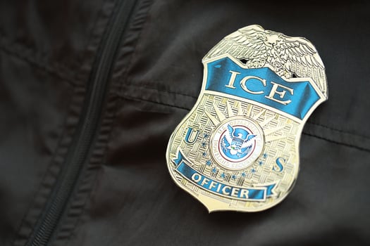 KYIV, UKRAINE - MARCH 9, 2024 US ICE Officer badge on black jacket uniform photo