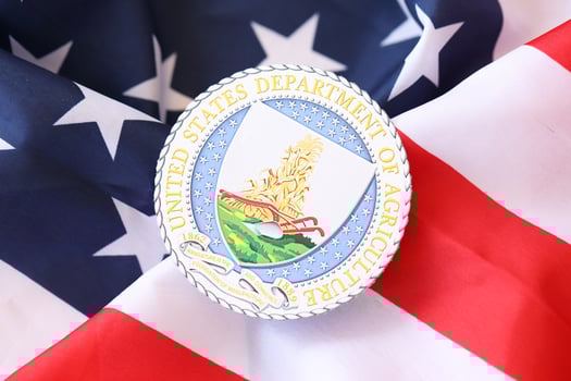 KYIV, UKRAINE - MARCH 9, 2024 US Department of Agriculture seal on United States of America flag photo