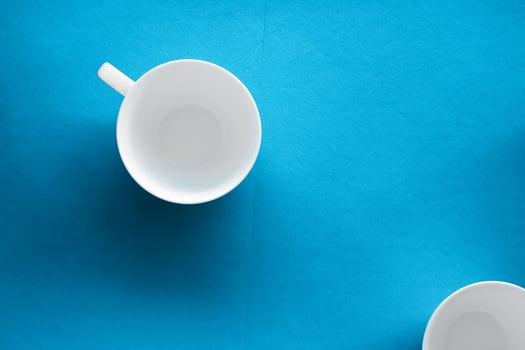 White tableware crockery set, empty cup on blue flatlay background photo