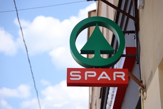 KHARKIV, UKRAINE - AUGUST 29, 2021 Spar logo on a wall. Spar is an international group of independently owned and operated retailers and wholesalers who work together photo