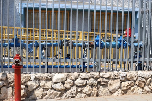 Water tap and pipes for pumping water to the pumping station. photo