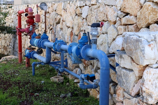 Water tap and pipes for pumping water to the pumping station. photo