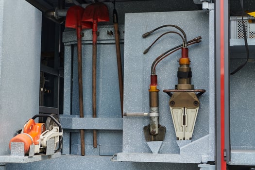 Close-up of essential firefighting equipment on a modern firetruck, showcasing tools and gear ready for emergency response to hazardous fire situations photo
