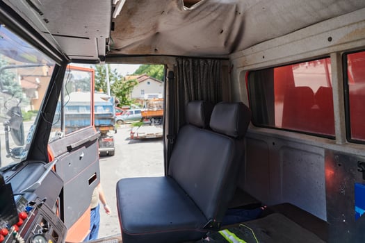 The close-up capture reveals the intricate details of the ergonomic seats and high-tech interior of a modern firefighting truck, showcasing a perfect blend of functionality and safety features photo