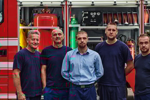 A skilled and dedicated professional firefighting team proudly poses in front of their state of the art firetruck, showcasing their modern equipment and commitment to ensuring public safety. photo