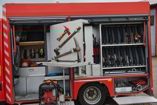 Close-up of essential firefighting equipment on a modern firetruck, showcasing tools and gear ready for emergency response to hazardous fire situations photo